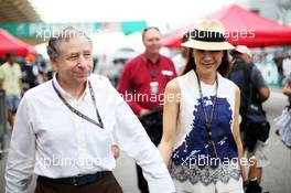 Jean Todt (FRA) FIA President with Michelle Yeoh (MAL). 24.03.2013. Formula 1 World Championship, Rd 2, Malaysian Grand Prix, Sepang, Malaysia, Sunday.