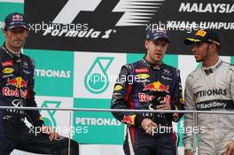 The podium (L to R): Mark Webber (AUS) Red Bull Racing, second; Sebastian Vettel (GER) Red Bull Racing, race winner; Lewis Hamilton (GBR) Mercedes AMG F1, third. 24.03.2013. Formula 1 World Championship, Rd 2, Malaysian Grand Prix, Sepang, Malaysia, Sunday.