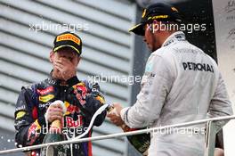 (L to R): Race winner Sebastian Vettel (GER) Red Bull Racing and Lewis Hamilton (GBR) Mercedes AMG F1 celebrate on the podium. 24.03.2013. Formula 1 World Championship, Rd 2, Malaysian Grand Prix, Sepang, Malaysia, Sunday.