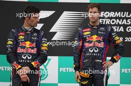 The podium (L to R): second placed Mark Webber (AUS) Red Bull Racing with race winner Sebastian Vettel (GER) Red Bull Racing. 24.03.2013. Formula 1 World Championship, Rd 2, Malaysian Grand Prix, Sepang, Malaysia, Sunday.