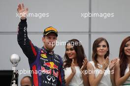 RACE WINNER Sebastian Vettel (GER) Red Bull Racing celebrates on the podium. 24.03.2013. Formula 1 World Championship, Rd 2, Malaysian Grand Prix, Sepang, Malaysia, Sunday.