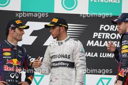 (L to R): Mark Webber (AUS) Red Bull Racing with third placed Lewis Hamilton (GBR) Mercedes AMG F1 and race winner Sebastian Vettel (GER) Red Bull Racing. 24.03.2013. Formula 1 World Championship, Rd 2, Malaysian Grand Prix, Sepang, Malaysia, Sunday.
