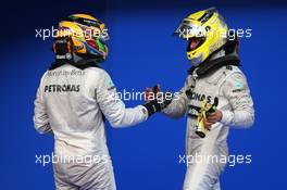 Lewis Hamilton (GBR) Mercedes AMG F1 and Nico Rosberg (GER) Mercedes AMG F1  24.03.2013. Formula 1 World Championship, Rd 2, Malaysian Grand Prix, Sepang, Malaysia, Sunday.
