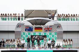 The podium (L to R): Mark Webber (AUS) Red Bull Racing, second; Sebastian Vettel (GER) Red Bull Racing, race winner; Lewis Hamilton (GBR) Mercedes AMG F1, third. 24.03.2013. Formula 1 World Championship, Rd 2, Malaysian Grand Prix, Sepang, Malaysia, Sunday.