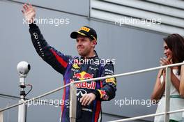Race winner Sebastian Vettel (GER) Red Bull Racing celebrates on the podium. 24.03.2013. Formula 1 World Championship, Rd 2, Malaysian Grand Prix, Sepang, Malaysia, Sunday.