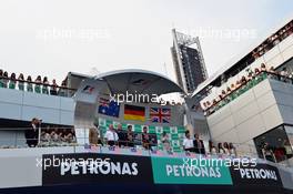 The podium (L to R): Mark Webber (AUS) Red Bull Racing, second; Sebastian Vettel (GER) Red Bull Racing, race winner; Lewis Hamilton (GBR) Mercedes AMG F1, third. 24.03.2013. Formula 1 World Championship, Rd 2, Malaysian Grand Prix, Sepang, Malaysia, Sunday.