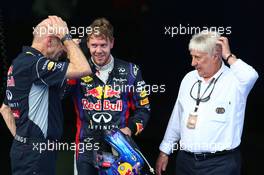 1st place Sebastian Vettel (GER) Red Bull Racing with Adrian Newey (GBR) Red Bull Racing Chief Technical Officer and Charlie Whiting (GBR) FIA Delegate  24.03.2013. Formula 1 World Championship, Rd 2, Malaysian Grand Prix, Sepang, Malaysia, Sunday.