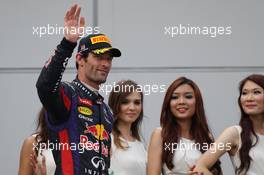 Mark Webber (AUS) Red Bull Racing celebrates his second position on the podium. 24.03.2013. Formula 1 World Championship, Rd 2, Malaysian Grand Prix, Sepang, Malaysia, Sunday.