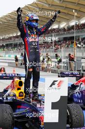 Race winner Sebastian Vettel (GER) Red Bull Racing RB9 celebrates in parc ferme. 24.03.2013. Formula 1 World Championship, Rd 2, Malaysian Grand Prix, Sepang, Malaysia, Sunday.