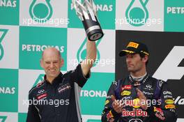 Adrian Newey (GBR) Red Bull Racing Chief Technical Officer celebrates on the podium with Mark Webber (AUS) Red Bull Racing. 24.03.2013. Formula 1 World Championship, Rd 2, Malaysian Grand Prix, Sepang, Malaysia, Sunday.