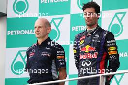 (L to R): Adrian Newey (GBR) Red Bull Racing Chief Technical Officer and Mark Webber (AUS) Red Bull Racing on the podium. 24.03.2013. Formula 1 World Championship, Rd 2, Malaysian Grand Prix, Sepang, Malaysia, Sunday.