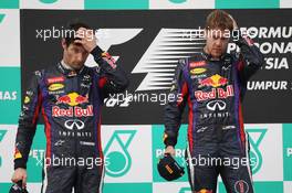 The podium (L to R): second placed Mark Webber (AUS) Red Bull Racing and team mate, race winner Sebastian Vettel (GER) Red Bull Racing. 24.03.2013. Formula 1 World Championship, Rd 2, Malaysian Grand Prix, Sepang, Malaysia, Sunday.