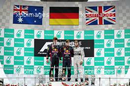 The podium (L to R): Mark Webber (AUS) Red Bull Racing, second; Sebastian Vettel (GER) Red Bull Racing, race winner; Lewis Hamilton (GBR) Mercedes AMG F1, third. 24.03.2013. Formula 1 World Championship, Rd 2, Malaysian Grand Prix, Sepang, Malaysia, Sunday.