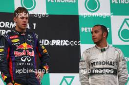 1st place Sebastian Vettel (GER) Red Bull Racing and 3rd place Lewis Hamilton (GBR) Mercedes AMG F1.  24.03.2013. Formula 1 World Championship, Rd 2, Malaysian Grand Prix, Sepang, Malaysia, Sunday.