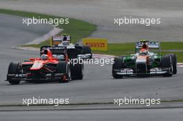 Adrian Sutil (GER) Sahara Force India VJM06 and Jules Bianchi (FRA) Marussia F1 Team MR02. 24.03.2013. Formula 1 World Championship, Rd 2, Malaysian Grand Prix, Sepang, Malaysia, Sunday.