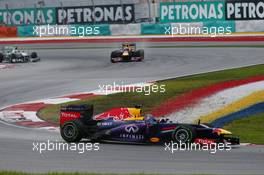 Sebastian Vettel (GER) Red Bull Racing RB9 leads Mark Webber (AUS) Red Bull Racing RB9 and Lewis Hamilton (GBR) Mercedes AMG F1 W04. 24.03.2013. Formula 1 World Championship, Rd 2, Malaysian Grand Prix, Sepang, Malaysia, Sunday.