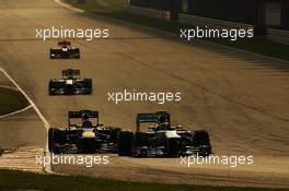 Lewis Hamilton (GBR) Mercedes AMG F1 W04 leads Sebastian Vettel (GER) Red Bull Racing RB9. 24.03.2013. Formula 1 World Championship, Rd 2, Malaysian Grand Prix, Sepang, Malaysia, Sunday.