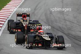 Romain Grosjean (FRA) Lotus F1 E21 leads team mate Kimi Raikkonen (FIN) Lotus F1 E21. 24.03.2013. Formula 1 World Championship, Rd 2, Malaysian Grand Prix, Sepang, Malaysia, Sunday.