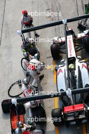 Sergio Perez (MEX) McLaren MP4-28 makes a pit stop. 24.03.2013. Formula 1 World Championship, Rd 2, Malaysian Grand Prix, Sepang, Malaysia, Sunday.