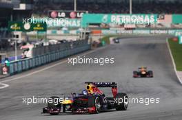 Sebastian Vettel (GER) Red Bull Racing RB9 leads the race from Mark Webber (AUS) Red Bull Racing RB9. 24.03.2013. Formula 1 World Championship, Rd 2, Malaysian Grand Prix, Sepang, Malaysia, Sunday.