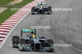 Lewis Hamilton (GBR) Mercedes AMG F1 W04 leads team mate Nico Rosberg (GER) Mercedes AMG F1 W04. 24.03.2013. Formula 1 World Championship, Rd 2, Malaysian Grand Prix, Sepang, Malaysia, Sunday.