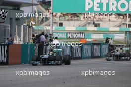 Third placed Lewis Hamilton (GBR) Mercedes AMG F1 W04 finishes ahead of team mate Nico Rosberg (GER) Mercedes AMG F1 W04. 24.03.2013. Formula 1 World Championship, Rd 2, Malaysian Grand Prix, Sepang, Malaysia, Sunday.