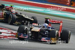 Jean-Eric Vergne (FRA) Scuderia Toro Rosso STR8 leads Romain Grosjean (FRA) Lotus F1 E21. 23.03.2013. Formula 1 World Championship, Rd 2, Malaysian Grand Prix, Sepang, Malaysia, Saturday.
