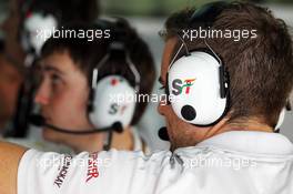 Sahara Force India F1 Team mechancs headphones. 23.03.2013. Formula 1 World Championship, Rd 2, Malaysian Grand Prix, Sepang, Malaysia, Saturday.
