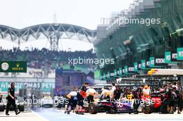 Sebastian Vettel (GER) Red Bull Racing RB9 in the pits. 23.03.2013. Formula 1 World Championship, Rd 2, Malaysian Grand Prix, Sepang, Malaysia, Saturday.