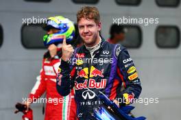 Sebastian Vettel (GER) Red Bull Racing celebrates his pole position in parc ferme. 23.03.2013. Formula 1 World Championship, Rd 2, Malaysian Grand Prix, Sepang, Malaysia, Saturday.