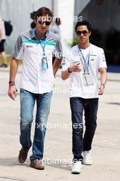 Jazeman Jaafar (MAL) Mercedes AMG F1 with Bruce Jouanny (FRA) Driver Coach. 24.03.2013. Formula 1 World Championship, Rd 2, Malaysian Grand Prix, Sepang, Malaysia, Sunday.