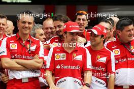 Fernando Alonso (ESP) Ferrari celebrates his 200th GP with team mate Felipe Massa (BRA) Ferrari and the team. 24.03.2013. Formula 1 World Championship, Rd 2, Malaysian Grand Prix, Sepang, Malaysia, Sunday.