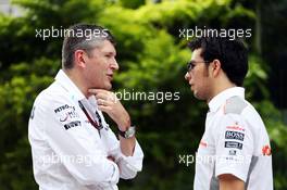(L to R): Nick Fry (GBR) Mercedes AMG F1 Chief Executive Officer with Sergio Perez (MEX) McLaren. 24.03.2013. Formula 1 World Championship, Rd 2, Malaysian Grand Prix, Sepang, Malaysia, Sunday.