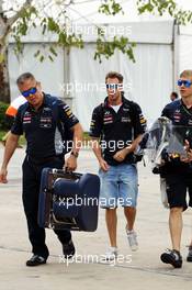 Sebastian Vettel (GER) Red Bull Racing with Heikki Huovinen (FIN) Personal Trainer (Right) and Paul Cheung (GBR) Red Bull Racing Team Chiropractor (Left). 24.03.2013. Formula 1 World Championship, Rd 2, Malaysian Grand Prix, Sepang, Malaysia, Sunday.