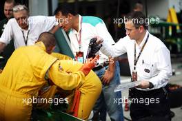 Dr Ian Roberts (GBR) FIA Doctor watches a practice extraction using the Caterham CT03. 21.03.2013. Formula 1 World Championship, Rd 2, Malaysian Grand Prix, Sepang, Malaysia, Thursday.