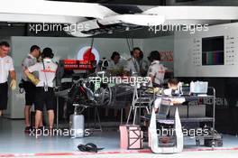 McLaren MP4-28 is prepared in the pits. 21.03.2013. Formula 1 World Championship, Rd 2, Malaysian Grand Prix, Sepang, Malaysia, Thursday.