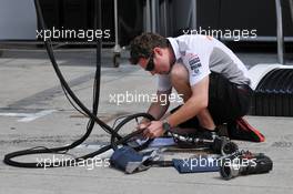 McLaren mechanic with an air gun. 21.03.2013. Formula 1 World Championship, Rd 2, Malaysian Grand Prix, Sepang, Malaysia, Thursday.