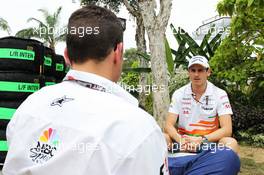 Adrian Sutil (GER) Sahara Force India F1 with Will Buxton (GBR) NBS Sports Network TV Presenter. 21.03.2013. Formula 1 World Championship, Rd 2, Malaysian Grand Prix, Sepang, Malaysia, Thursday.