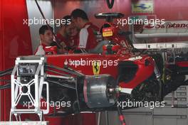 Ferrari F138 is prepared in the pits. 21.03.2013. Formula 1 World Championship, Rd 2, Malaysian Grand Prix, Sepang, Malaysia, Thursday.