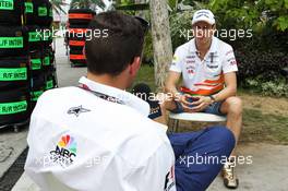 Adrian Sutil (GER) Sahara Force India F1 with Will Buxton (GBR) NBS Sports Network TV Presenter. 21.03.2013. Formula 1 World Championship, Rd 2, Malaysian Grand Prix, Sepang, Malaysia, Thursday.