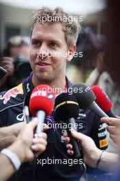 Sebastian Vettel (GER) Red Bull Racing with the media. 21.03.2013. Formula 1 World Championship, Rd 2, Malaysian Grand Prix, Sepang, Malaysia, Thursday.