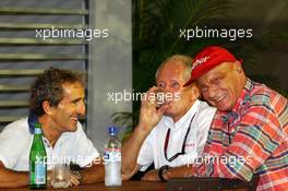 (L to R): Alain Prost (FRA) with Dr Helmut Marko (AUT) Red Bull Motorsport Consultant and Niki Lauda (AUT) Mercedes Non-Executive Chairman. 20.09.2013. Formula 1 World Championship, Rd 13, Singapore Grand Prix, Singapore, Singapore, Practice Day.
