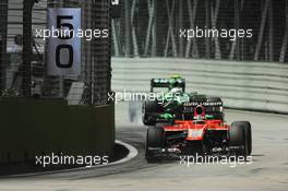 Jules Bianchi (FRA) Marussia F1 Team MR02 leads Giedo van der Garde (NLD) Caterham CT03. 20.09.2013. Formula 1 World Championship, Rd 13, Singapore Grand Prix, Singapore, Singapore, Practice Day.