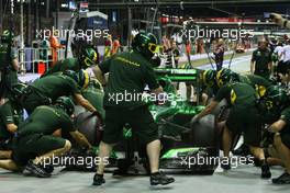 Charles Pic (FRA) Caterham CT03 practices a pit stop. 20.09.2013. Formula 1 World Championship, Rd 13, Singapore Grand Prix, Singapore, Singapore, Practice Day.