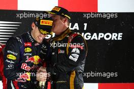 Sebastian Vettel (GER) Red Bull Racing and Kimi Raikkonen (FIN) Lotus F1 Team. 22.09.2013. Formula 1 World Championship, Rd 13, Singapore Grand Prix, Singapore, Singapore, Race Day.