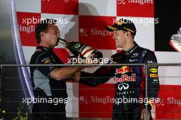 Christian Horner (GBR) Red Bull Racing Team Principal and Sebastian Vettel (GER) Red Bull Racing. 22.09.2013. Formula 1 World Championship, Rd 13, Singapore Grand Prix, Singapore, Singapore, Race Day.