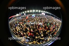 The crowd invade the circuit at the podium. 22.09.2013. Formula 1 World Championship, Rd 13, Singapore Grand Prix, Singapore, Singapore, Race Day.