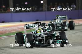 Nico Rosberg (GER) Mercedes AMG F1 W04 leads team mate Lewis Hamilton (GBR) Mercedes AMG F1 W04. 22.09.2013. Formula 1 World Championship, Rd 13, Singapore Grand Prix, Singapore, Singapore, Race Day.
