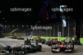 Lewis Hamilton (GBR) Mercedes AMG F1 W04 and Felipe Massa (BRA) Ferrari F138 at the start of the race. 22.09.2013. Formula 1 World Championship, Rd 13, Singapore Grand Prix, Singapore, Singapore, Race Day.