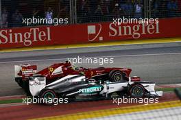 Lewis Hamilton (GBR) Mercedes AMG F1 W04 and Felipe Massa (BRA) Ferrari F138 at the start of the race. 22.09.2013. Formula 1 World Championship, Rd 13, Singapore Grand Prix, Singapore, Singapore, Race Day.
